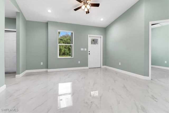 interior space featuring ceiling fan