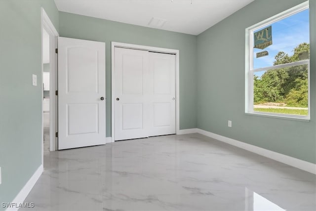 unfurnished bedroom featuring a closet