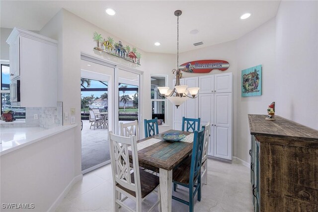 dining space with a chandelier