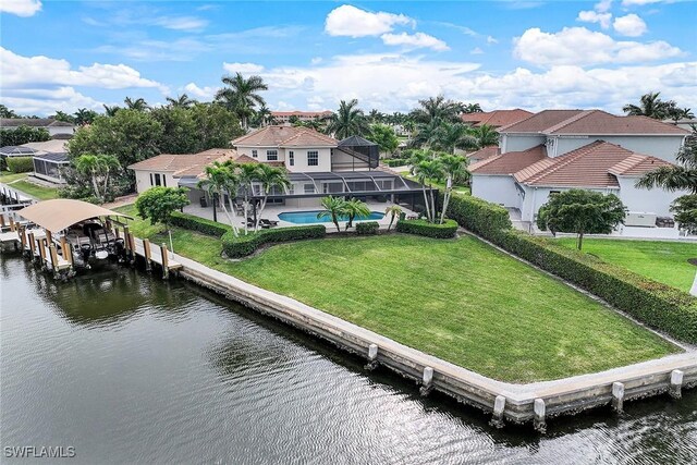 dock area featuring a lawn, a water view, and glass enclosure