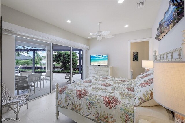 bedroom featuring access to outside, light tile patterned floors, and ceiling fan