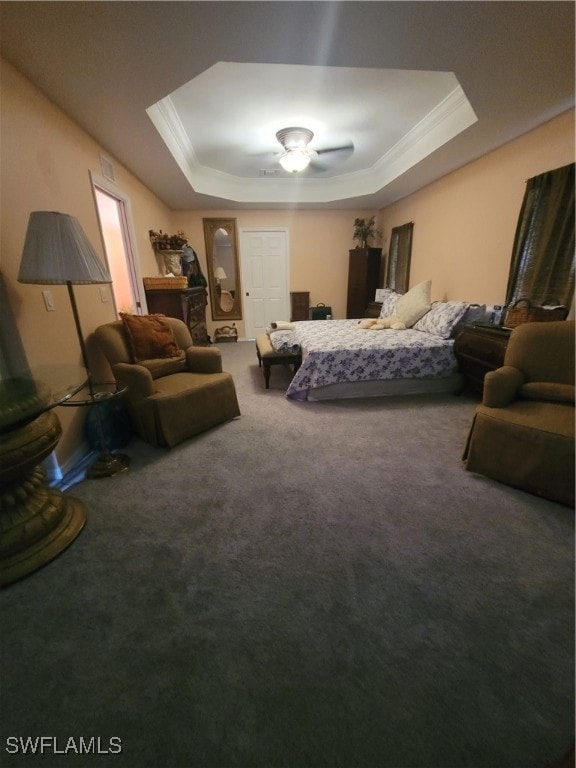 bedroom featuring carpet flooring, a tray ceiling, and ornamental molding