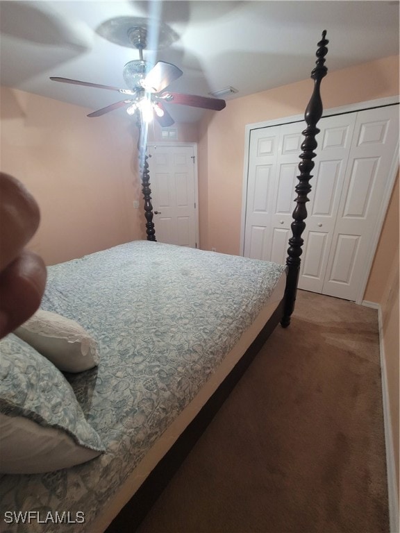 bedroom featuring ceiling fan, multiple closets, and carpet floors