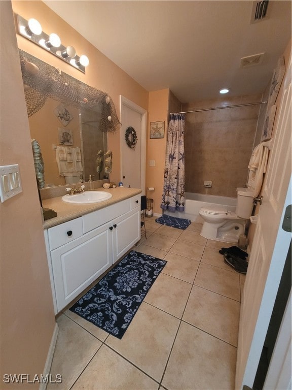 full bathroom with vanity, toilet, tile patterned floors, and shower / bath combo