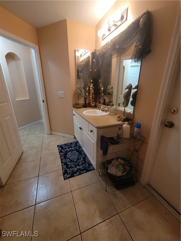 bathroom with tile patterned flooring and vanity