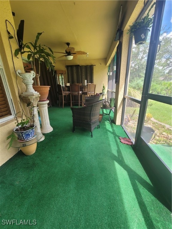 sunroom / solarium with ceiling fan and plenty of natural light