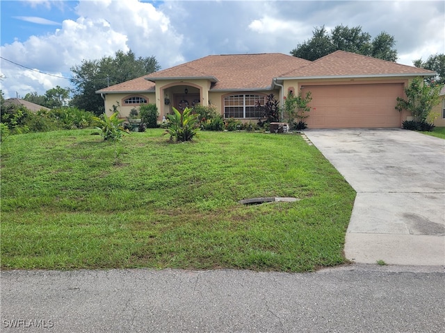 view of front of home featuring a garage and a front lawn