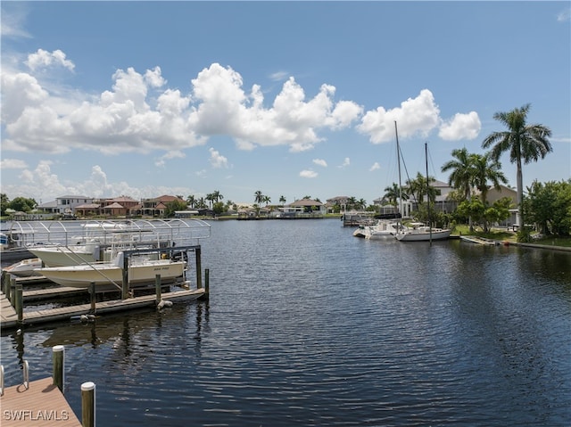 dock area featuring a residential view and a water view