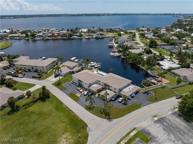 birds eye view of property featuring a residential view and a water view