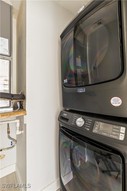 laundry area featuring stacked washer and dryer