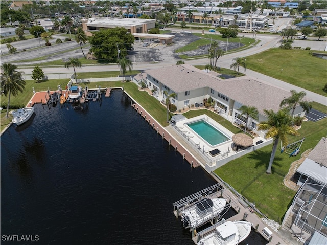 birds eye view of property with a water view