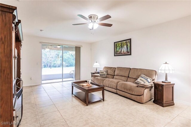 living room with light tile patterned flooring and ceiling fan