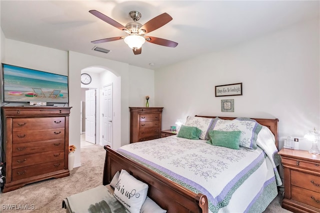 bedroom with light carpet and ceiling fan