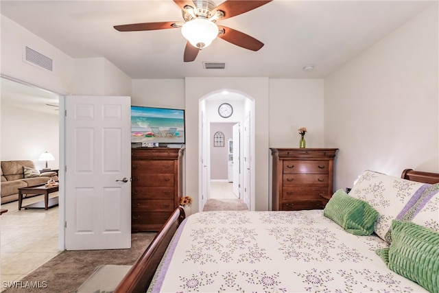 bedroom featuring ceiling fan and light tile patterned floors