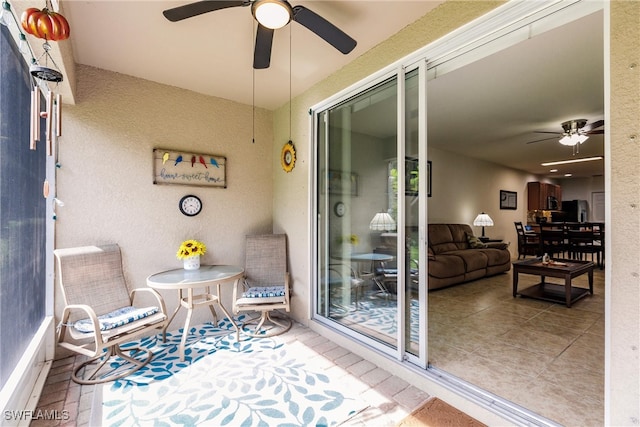 balcony featuring ceiling fan