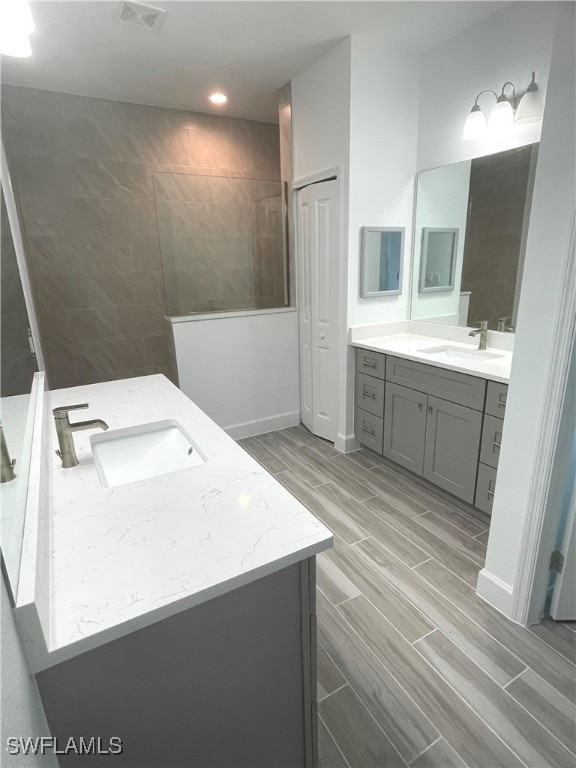 bathroom with wood-type flooring and vanity