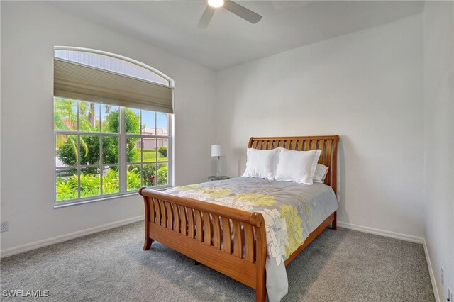 bedroom with ceiling fan and carpet flooring