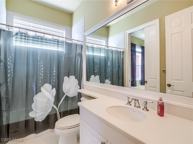 bathroom with tile patterned floors, toilet, a shower with shower curtain, and vanity