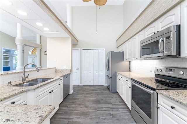 kitchen featuring sink, stainless steel appliances, and white cabinets