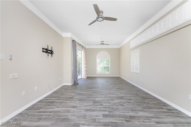 unfurnished room with ceiling fan, crown molding, and light hardwood / wood-style floors