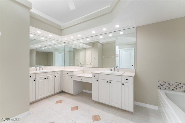 bathroom featuring vanity, tile patterned flooring, and a washtub