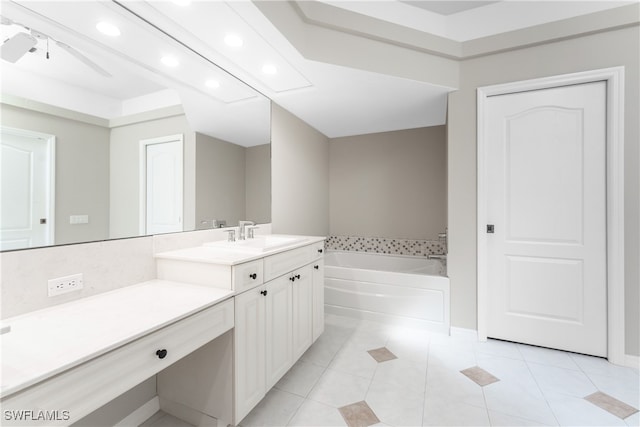 bathroom with vanity, tile patterned floors, ceiling fan, and a washtub