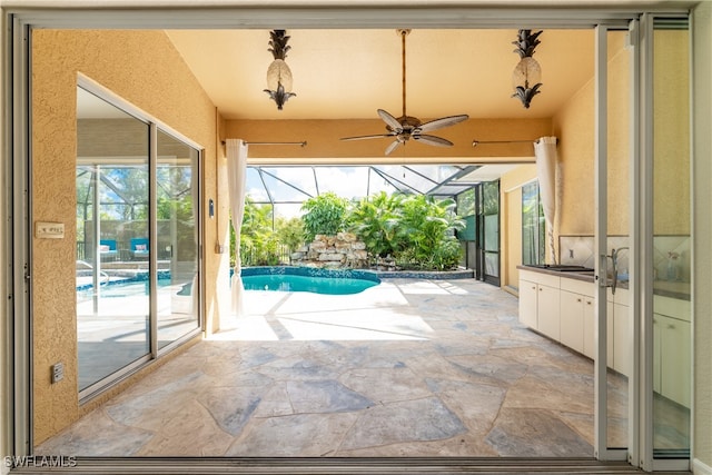 view of pool with a patio and ceiling fan