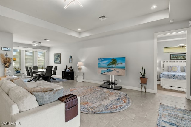 living room with a raised ceiling