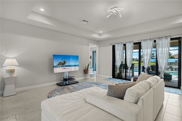 living room with light tile patterned flooring