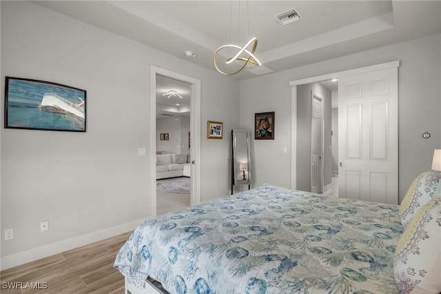 bedroom with light hardwood / wood-style flooring