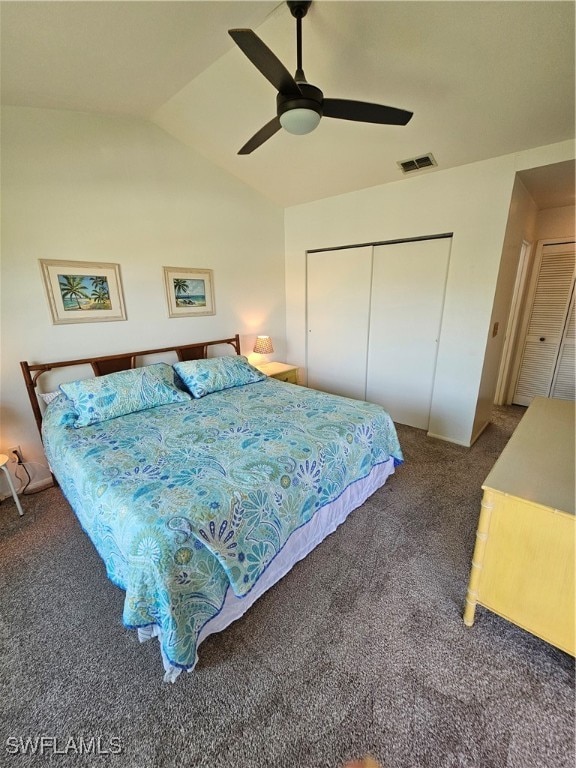 carpeted bedroom with lofted ceiling, ceiling fan, and a closet