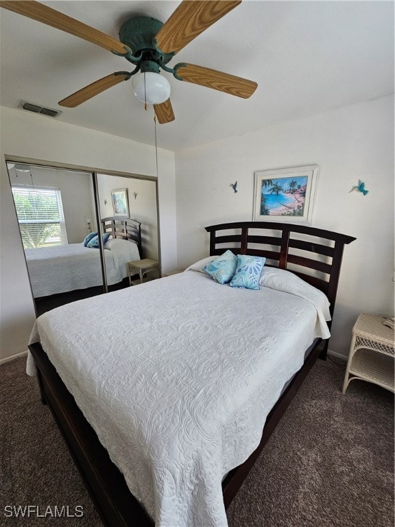 carpeted bedroom featuring ceiling fan and a closet