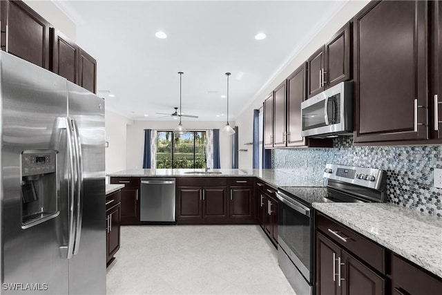 kitchen with ceiling fan, stainless steel appliances, kitchen peninsula, decorative light fixtures, and decorative backsplash