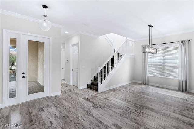 entrance foyer with light wood-type flooring and ornamental molding