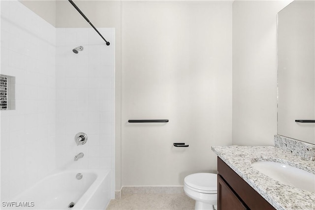 full bathroom featuring tiled shower / bath, vanity, and toilet