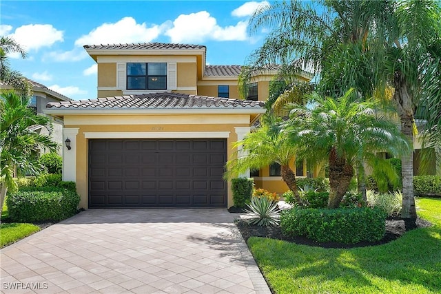 mediterranean / spanish-style home featuring a garage