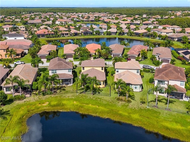 drone / aerial view with a water view