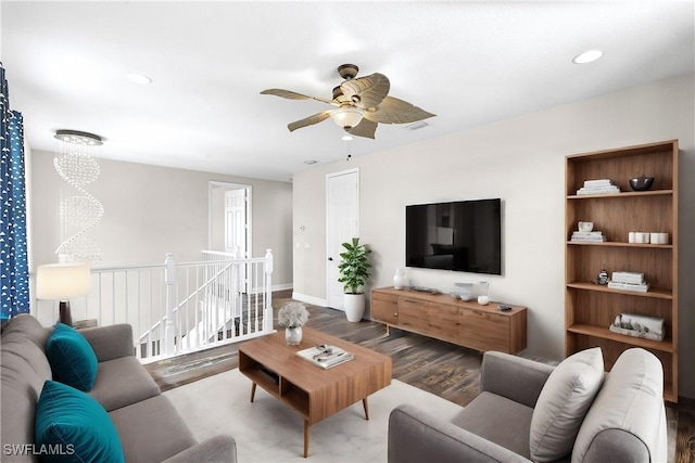 living room with hardwood / wood-style floors and ceiling fan