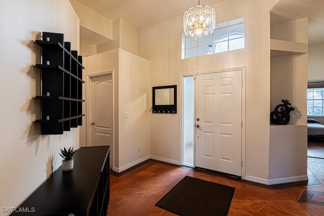 foyer entrance with an inviting chandelier