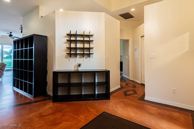 hallway featuring dark carpet