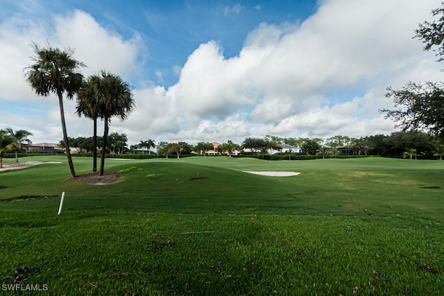 view of property's community featuring a lawn