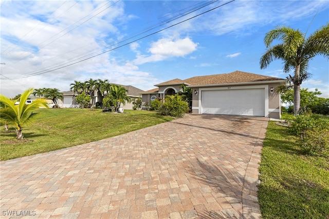 view of front of property featuring a garage and a front yard