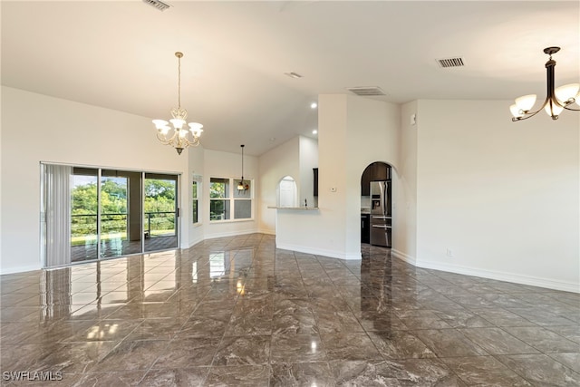 interior space with a high ceiling and a notable chandelier