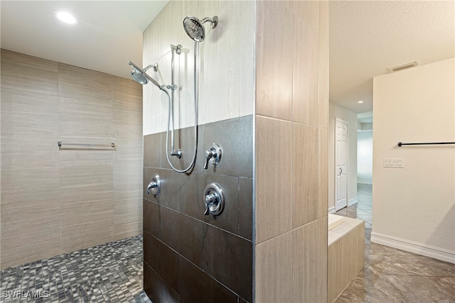 bathroom featuring tiled shower