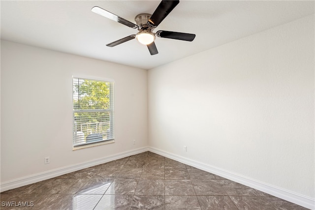 spare room featuring ceiling fan