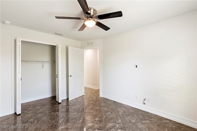 unfurnished bedroom with a closet and ceiling fan