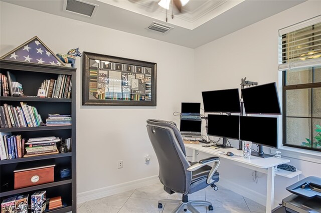 office space with light tile patterned floors and crown molding