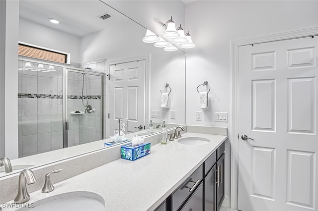 bathroom with vanity and an enclosed shower