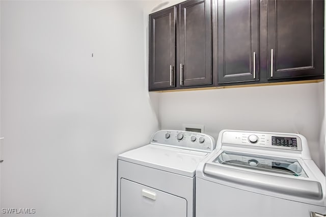 10911 Glenhurst St, Fort Myers, FL 33913 - laundry area featuring washer and clothes dryer and cabinet space