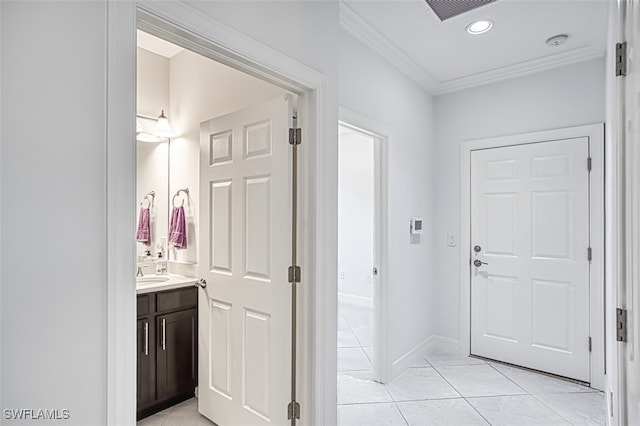 interior space with light tile patterned floors and sink